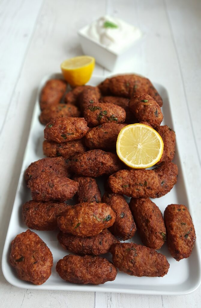 cypriot keftedes meatballs served with lemon and tzatziki