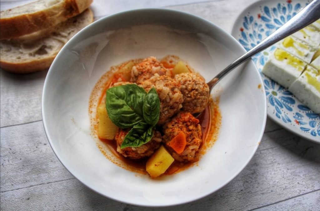 Giouvarlakia with tomato sauce. Served with feta cheese and warm, crusty bread.