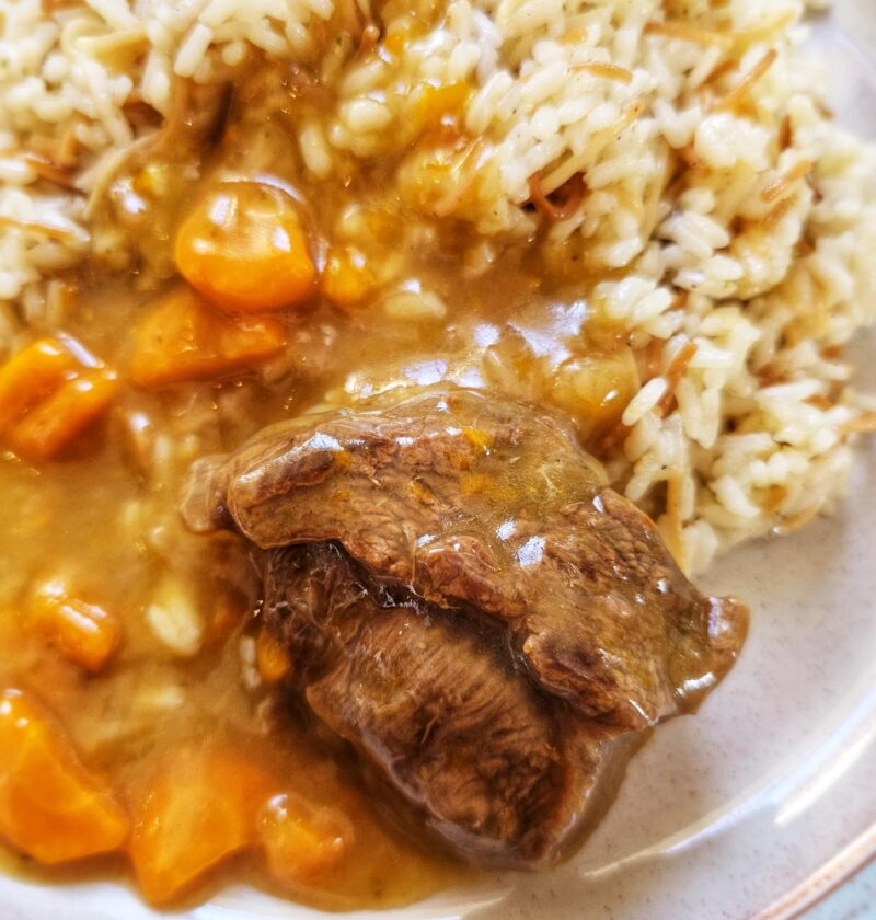 plate of greek food beef lemonato with white rice