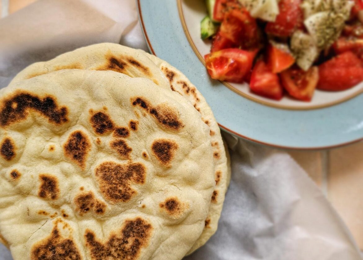 greek pita bread with a side of greek salad