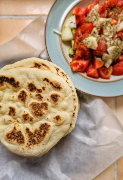 greek pita bread with a side of greek salad