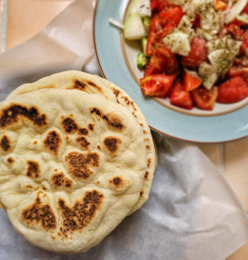 greek pita bread with a side of greek salad