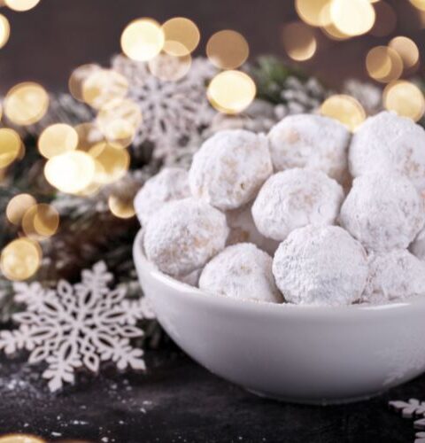 greek christmas cookies kourambiedes in a bowl with christmas decoration