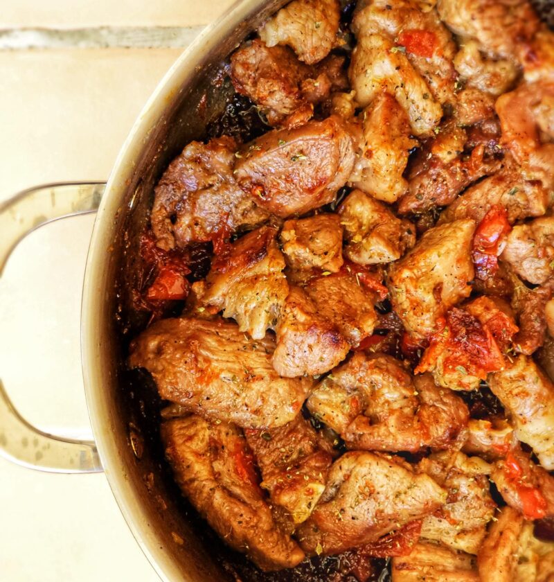 a pan of yummy greek marinated pork belly in beer